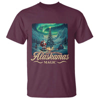 Men's maroon t-shirt with 'Alaskamas Magic' aurora Santa landscape graphic