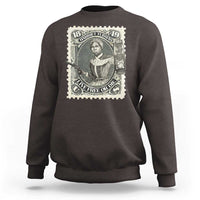 Dark brown sweatshirt with front Harriet Tubman postage-stamp graphic