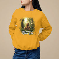 Gold sweatshirt with bear fairy forest graphic and "Don't Mess with Mama Bear" print