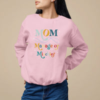 Light pink women's sweatshirt with 'MOM Manage of Mischief' graphic on front