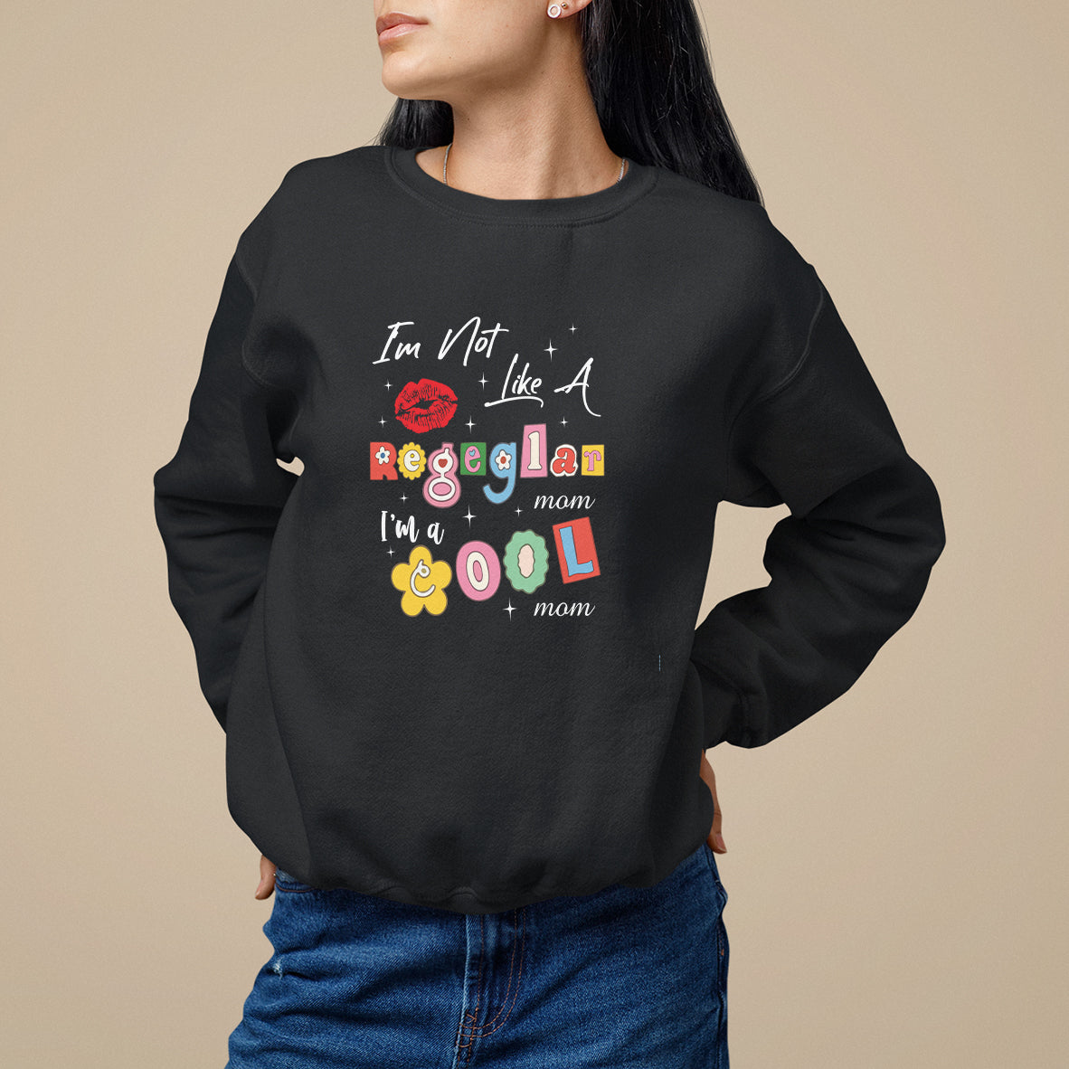 Black crewneck sweatshirt with colorful 'cool mom' graphic on front