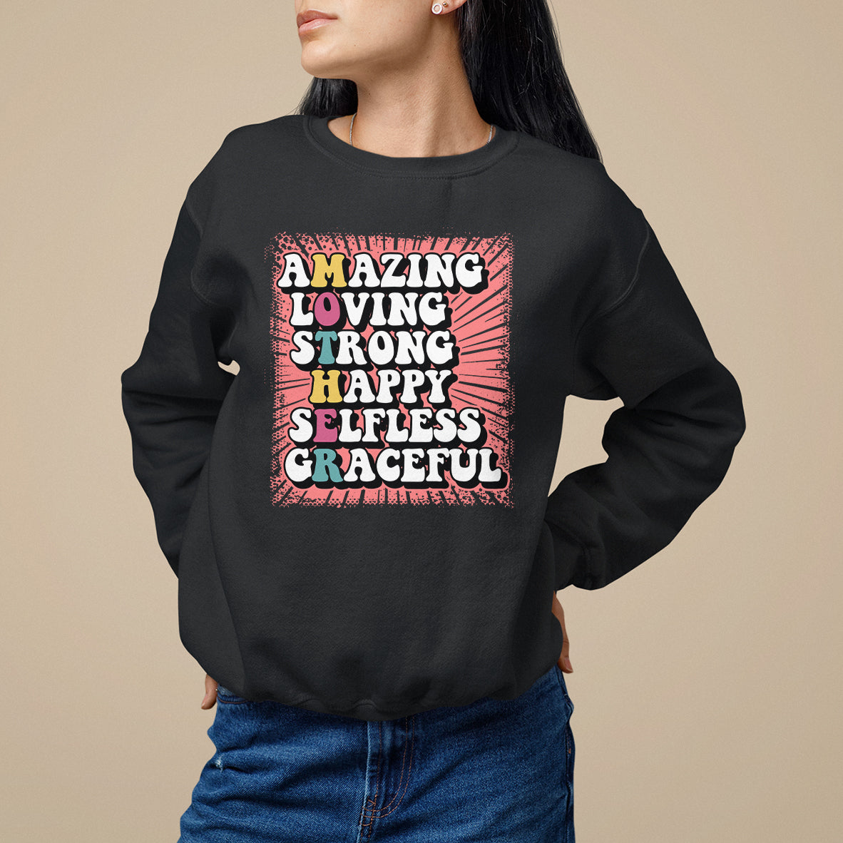 Women's black sweatshirt with front graphic text 'AMAZING LOVING STRONG HAPPY'