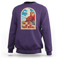 Purple crewneck sweatshirt with New Mexico graphic print on chest