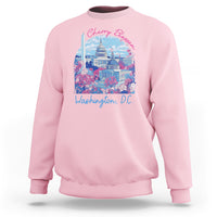 Light pink crewneck sweatshirt with colorful cherry blossom city graphic on chest