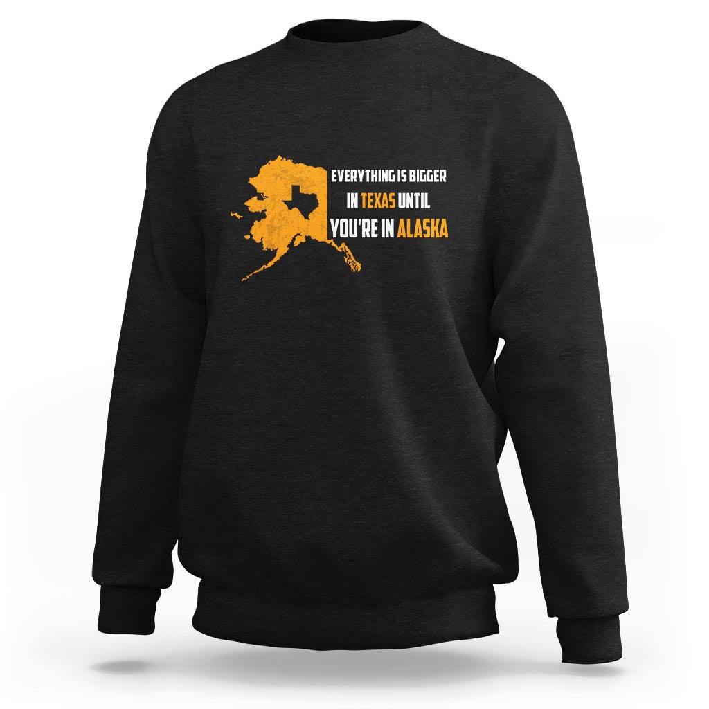 Black crewneck sweatshirt with yellow map and text graphic on chest