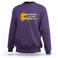 Purple crewneck sweatshirt with yellow map and text graphic on chest