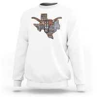 White crewneck sweatshirt with Texas map graphic and longhorn design.