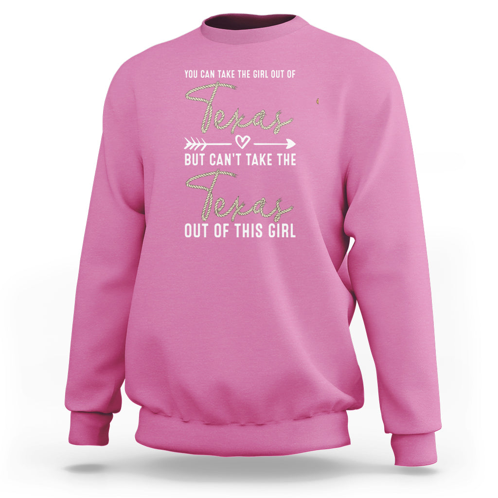 Pink crewneck girl sweatshirt with Texas graphic and “can’t take the Texas out” text