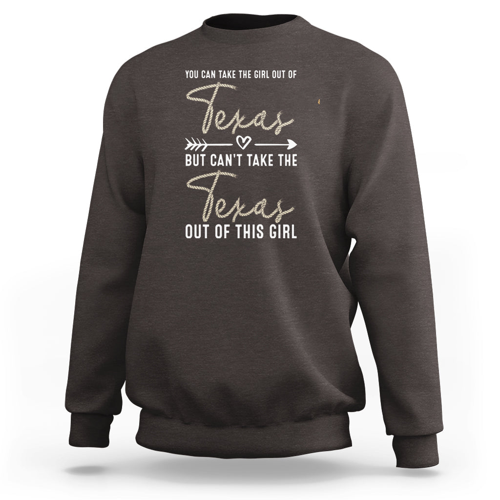 Dark brown crewneck girl sweatshirt with Texas graphic and “can’t take the Texas out” text