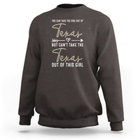 Dark brown crewneck girl sweatshirt with Texas graphic and “can’t take the Texas out” text