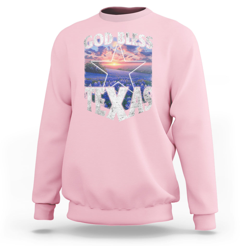 Light pink crewneck sweatshirt with 'GOD BLESS TEXAS' graphic front