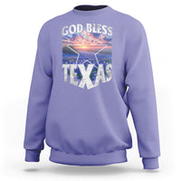 Lavender crewneck sweatshirt with 'GOD BLESS TEXAS' graphic front