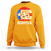 Gold crewneck sweatshirt with coqui graphic and BORICUA text on chest