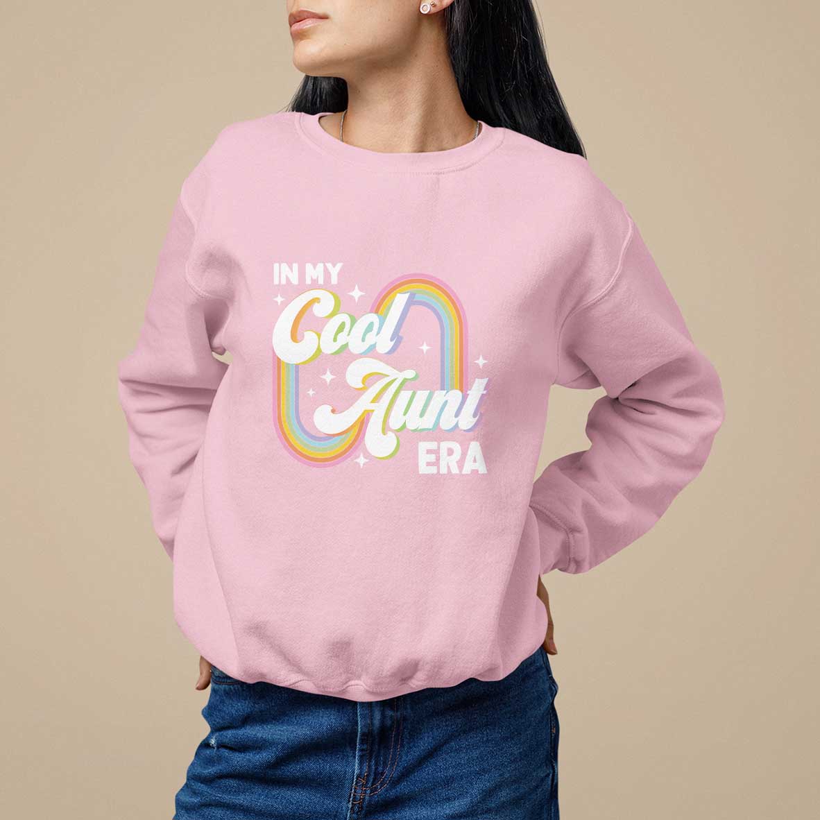 Light pink crewneck sweatshirt with rainbow “Cool Aunt Era” front graphic