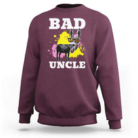 Maroon crewneck sweatshirt with “BAD UNCL E” text and dog graphic with splatter