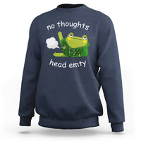 Navy sweatshirt with frog graphic and 'no thoughts'/'head empty' print, crew neck.