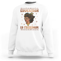 Women's white sweatshirt with Education is Freedom graphic and teacher portrait