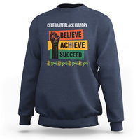 Navy sweatshirt with “Believe Achieve Succeed” graphic and “Celebrate Black History” text