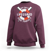 Maroon crewneck sweatshirt with lifeguard ring graphic and “Save Yourself” text