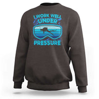 Dark gray crewneck sweatshirt with scuba diving “Work Well Under Pressure” graphic
