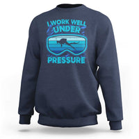 Navy blue crewneck sweatshirt with scuba diving “Work Well Under Pressure” graphic