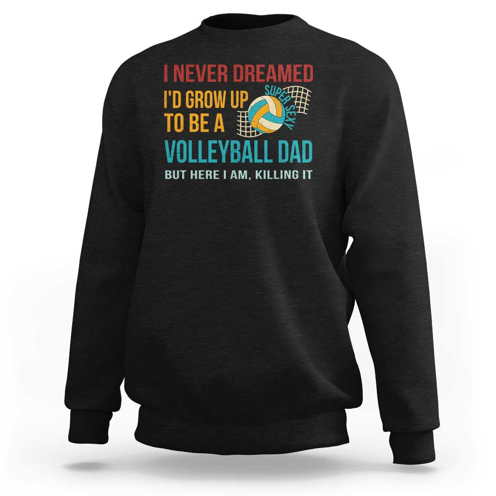 Black crewneck sweatshirt with “Volleyball Dad” graphic and colorful text design