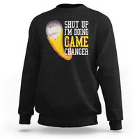 Black baseball sweatshirt with graphic text “SHUT UP I’M DOING GAME CHANGER”