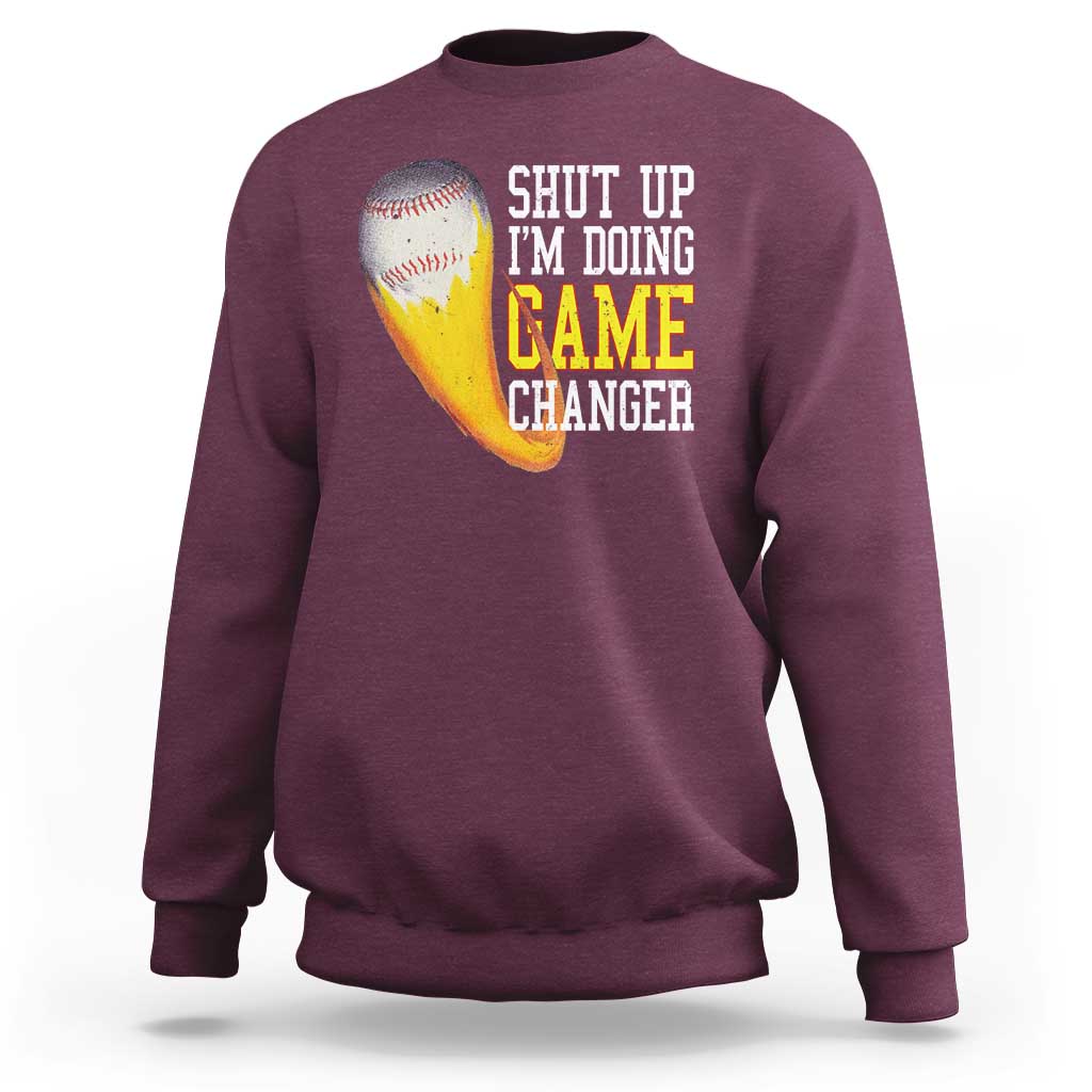 Maroon baseball sweatshirt with graphic text “SHUT UP I’M DOING GAME CHANGER”