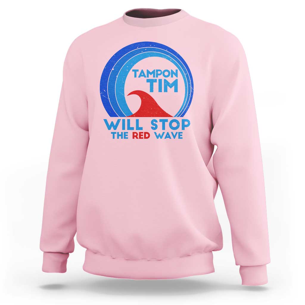 Light pink crewneck sweatshirt with circular graphic and text “WILL STOP THE RED WAVE”.