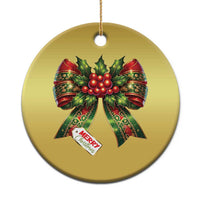 Gold circular Christmas bow ornament with red holly ribbons and “Merry Christmas” tag