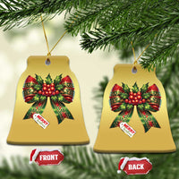Gold bell-shaped Christmas bow ornaments with red holly ribbons and “Merry Christmas” tag