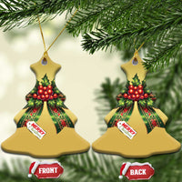 Gold Christmas bow ornaments in tree shape with red holly ribbons and “Merry Christmas”