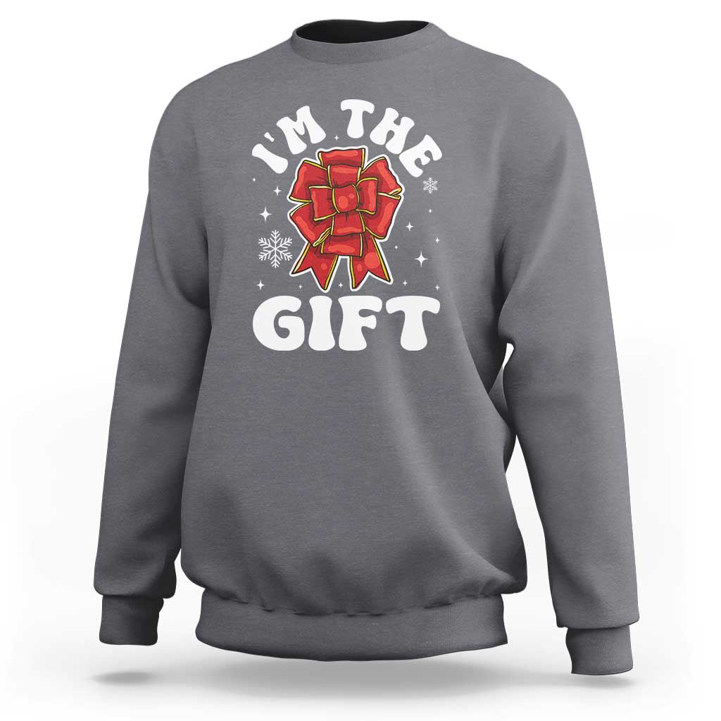 Charcoal gray unisex Christmas sweatshirt with 'I'm the gift' graphic and red bow illustration