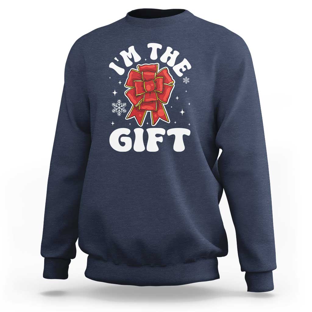 Navy unisex Christmas sweatshirt with 'I'm the gift' graphic and red bow illustration