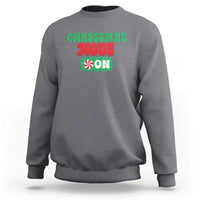 Charcoal gray crewneck sweatshirt with front holiday graphic text, long sleeves