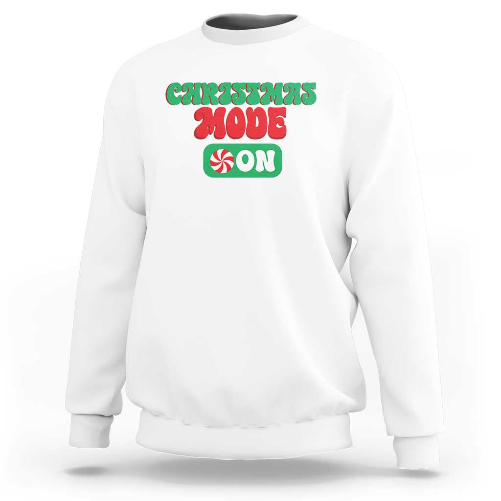 White crewneck sweatshirt with front holiday graphic text, long sleeves