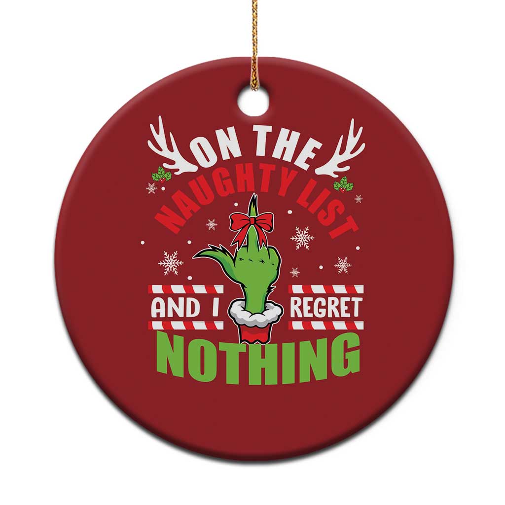Red round Christmas ornament with “On the naughty list and I regret nothing” text.