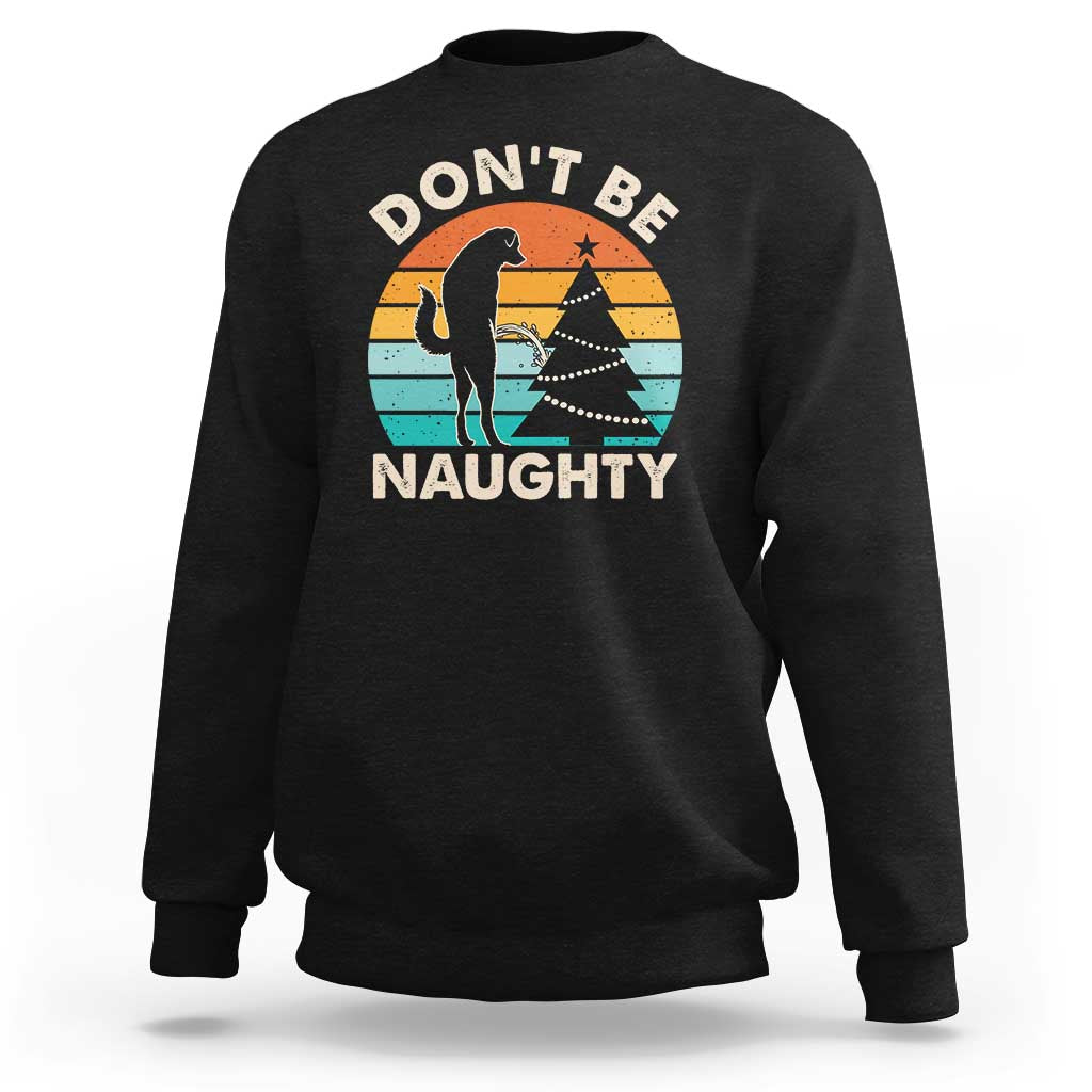 Black crewneck sweatshirt with “DON’T BE NAUGHTY” graphic and dog silhouette