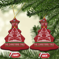 Two red Christmas tree bell ornaments with hanging gold loops and festive tree graphic