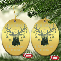 Gold oval deer Christmas ornaments with “OH DEER” and “Christmas is here” text