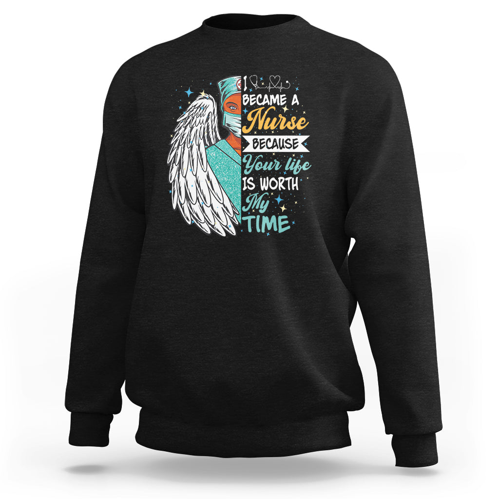 Black sweatshirt with nurse quote graphic and angel wing print on front.