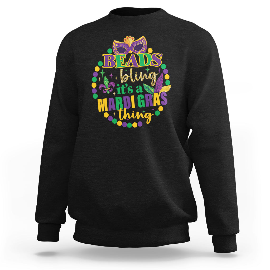 Black crewneck sweatshirt with multicolor “Beads bling” Mardi Gras graphic on front.