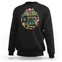 Black crewneck sweatshirt with multicolor “Beads bling” Mardi Gras graphic on front.