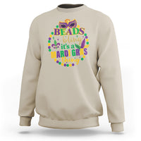 Sand crewneck sweatshirt with multicolor “Beads bling” Mardi Gras graphic on front.