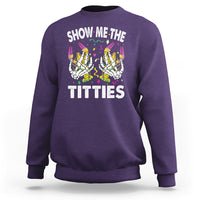 Purple crewneck sweatshirt with colorful skeleton graphic and “TITTIES” front text