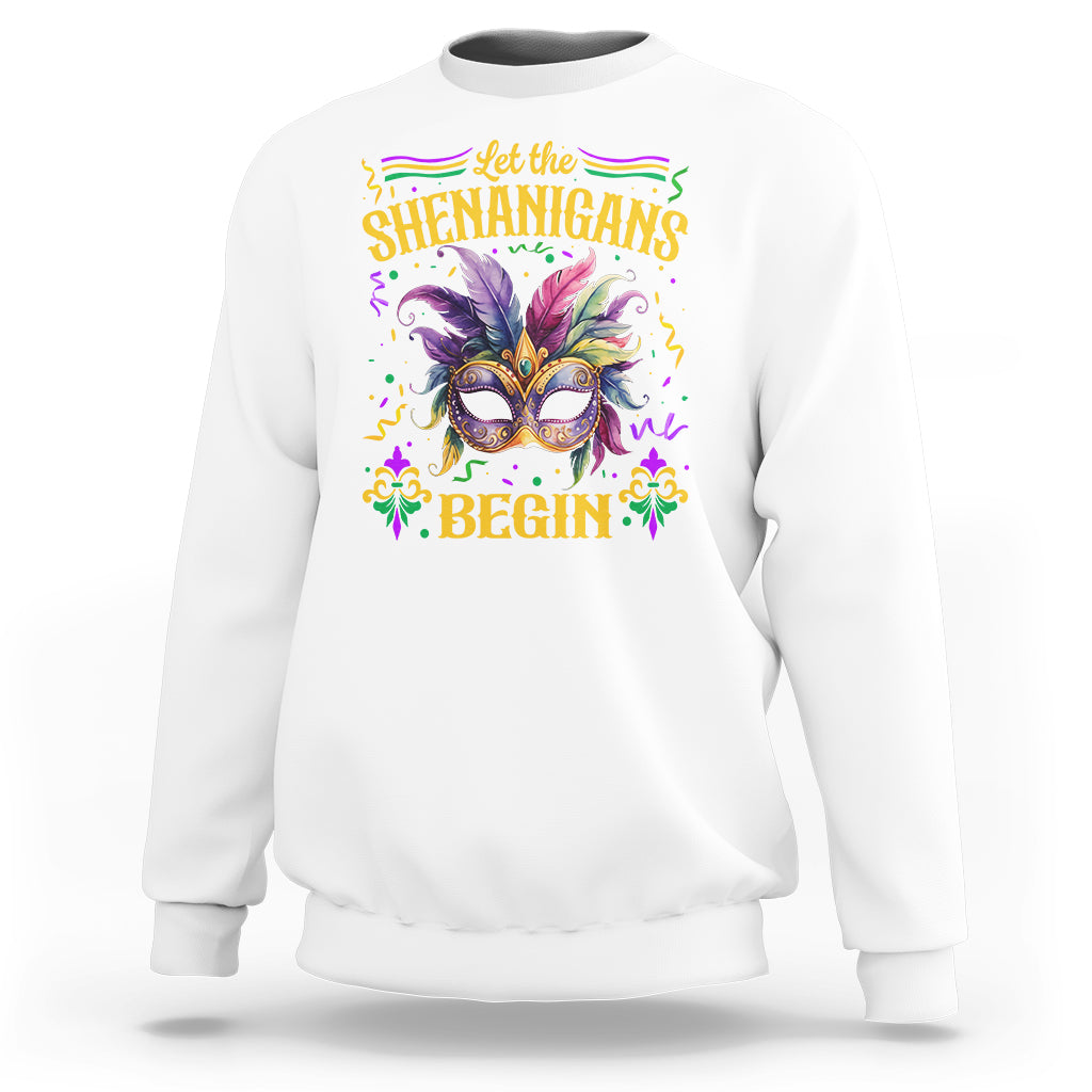 White Mardi Gras sweatshirt with masquerade mask graphic and 'Shenanigans Begin'.
