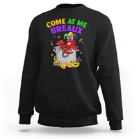 Black crewneck sweatshirt with colorful Mardi Gras crawfish graphic on chest