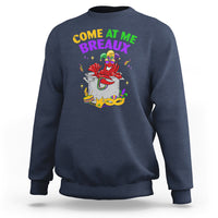 Dark blue crewneck sweatshirt with colorful Mardi Gras crawfish graphic on chest