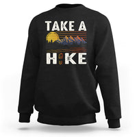 Black hiking sweatshirt with “Take a Hike” front graphic and mountain scene