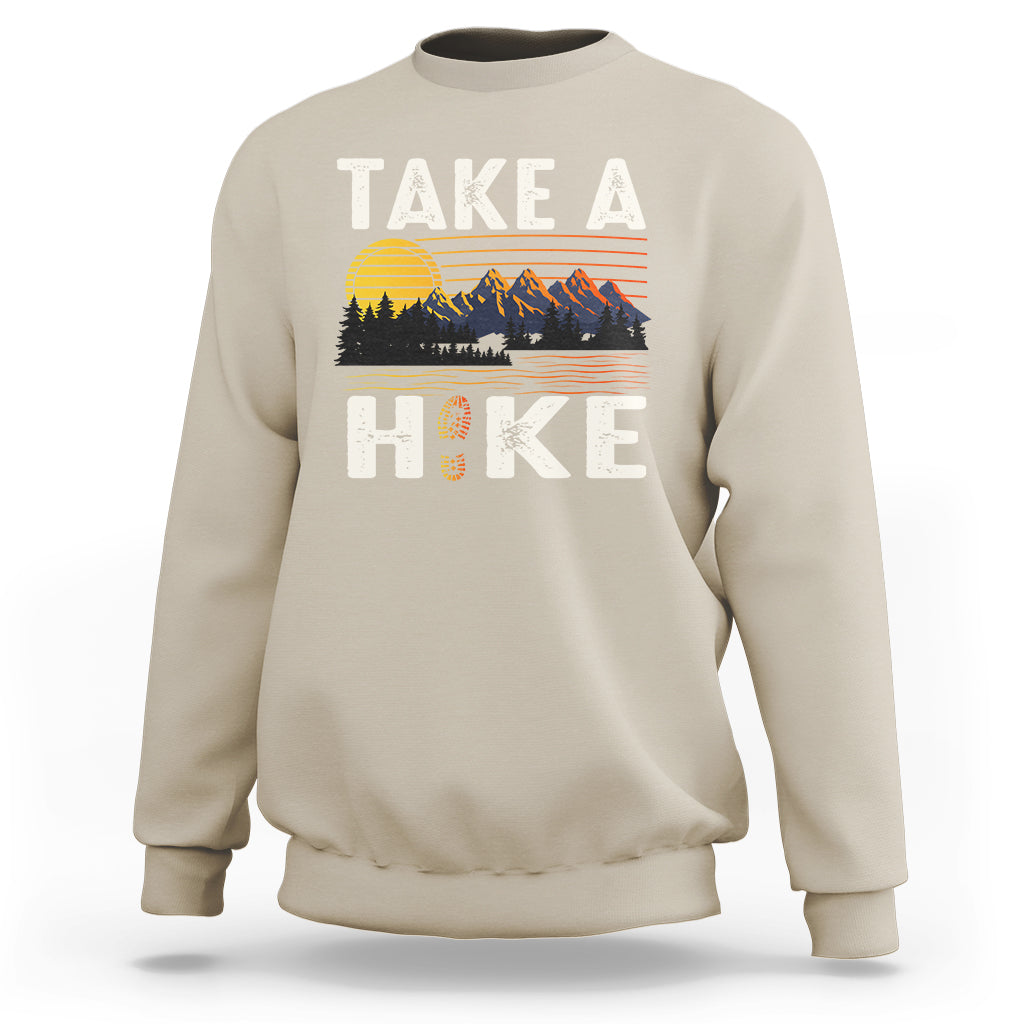 Sand beige hiking sweatshirt with “Take a Hike” front graphic and mountain scene